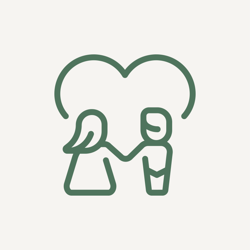 A green icon representing two people embracing or shaking hands